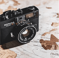 Vintage camera on map